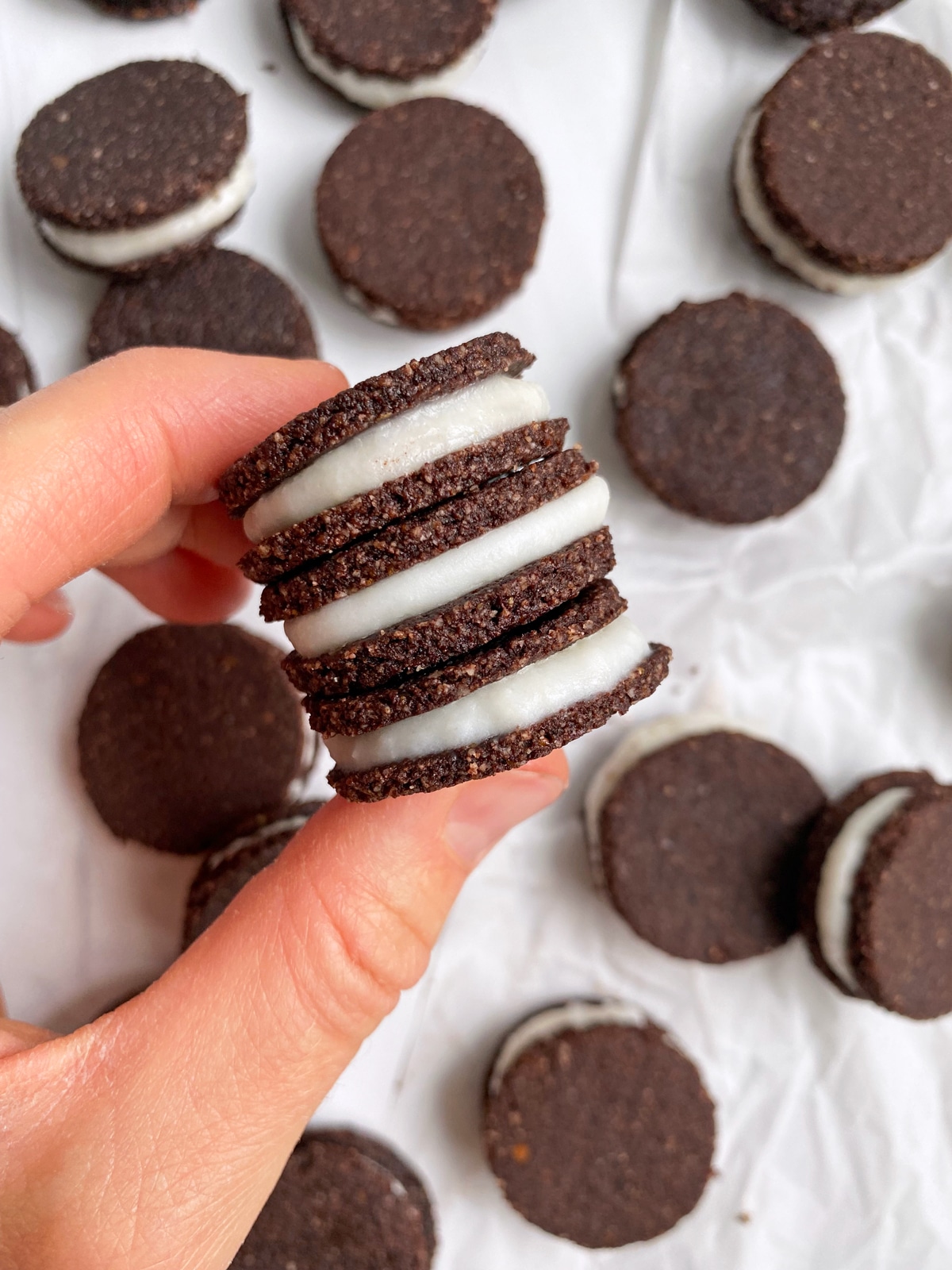 holding-black-and-white-cookies