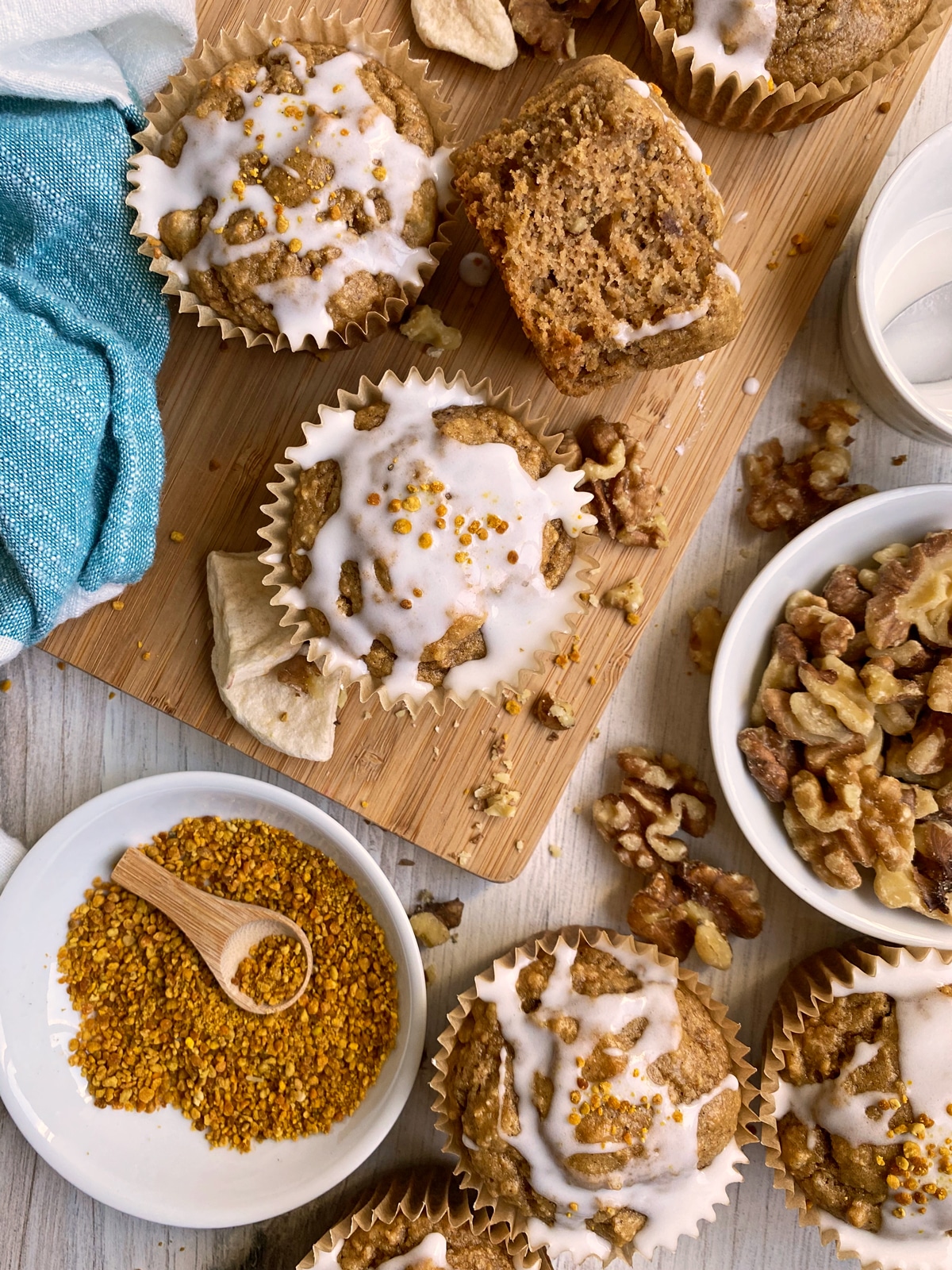 apple walnut muffins topped with icing