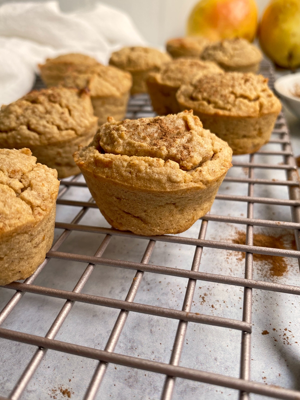 side view of pear muffins on wire cooling rack