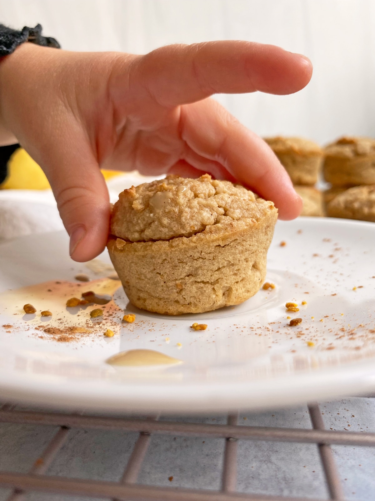 toddler grabbing a mini muffin