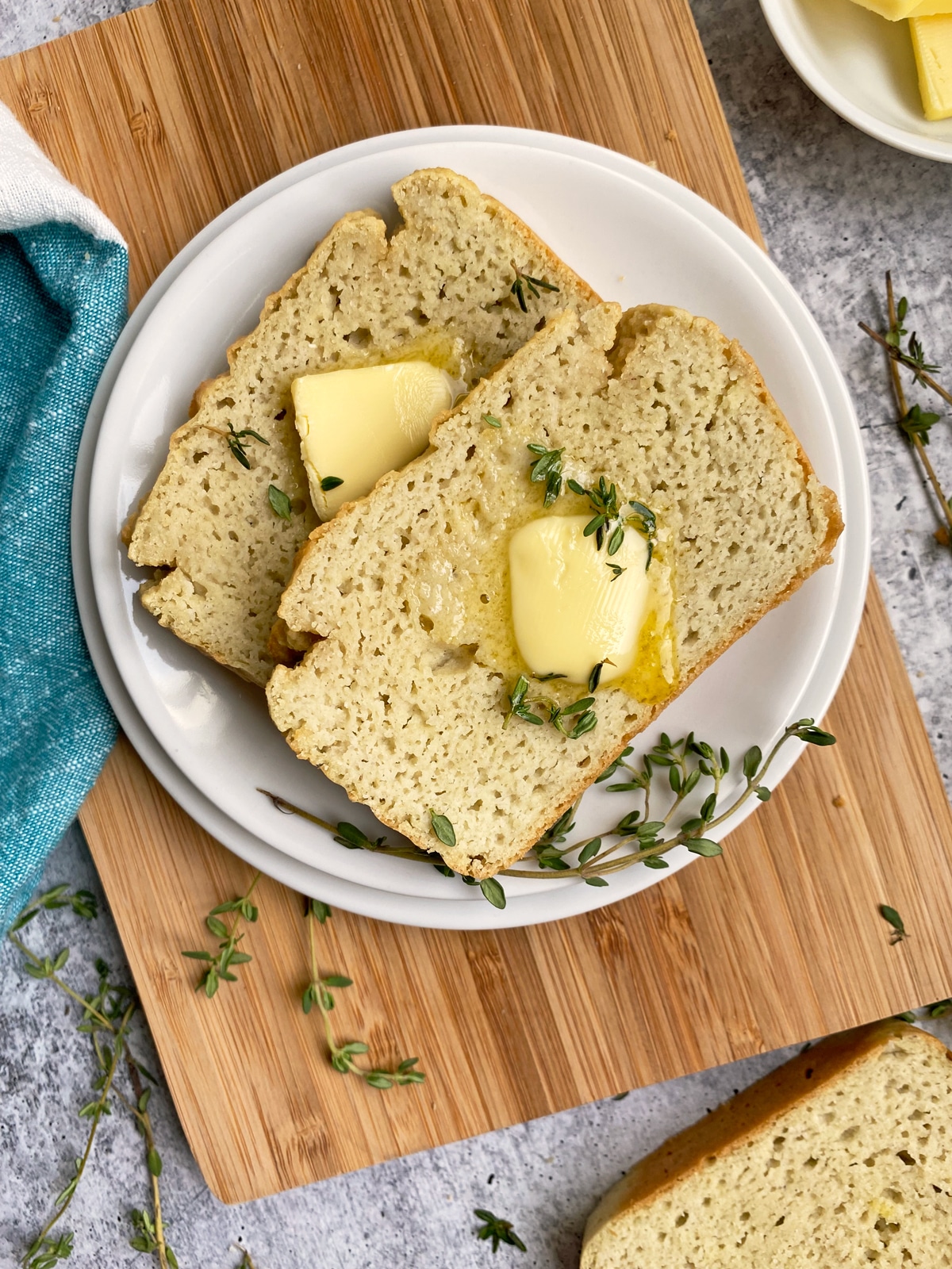 slices of bread topped with butter and thyme