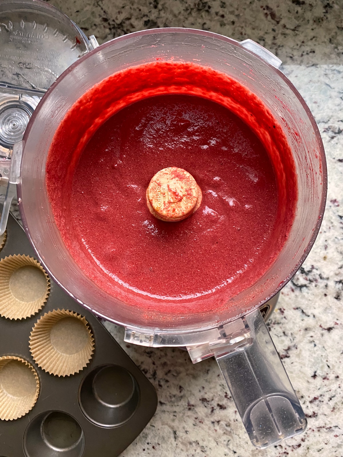 Red velvet cupcake batter in food processor.