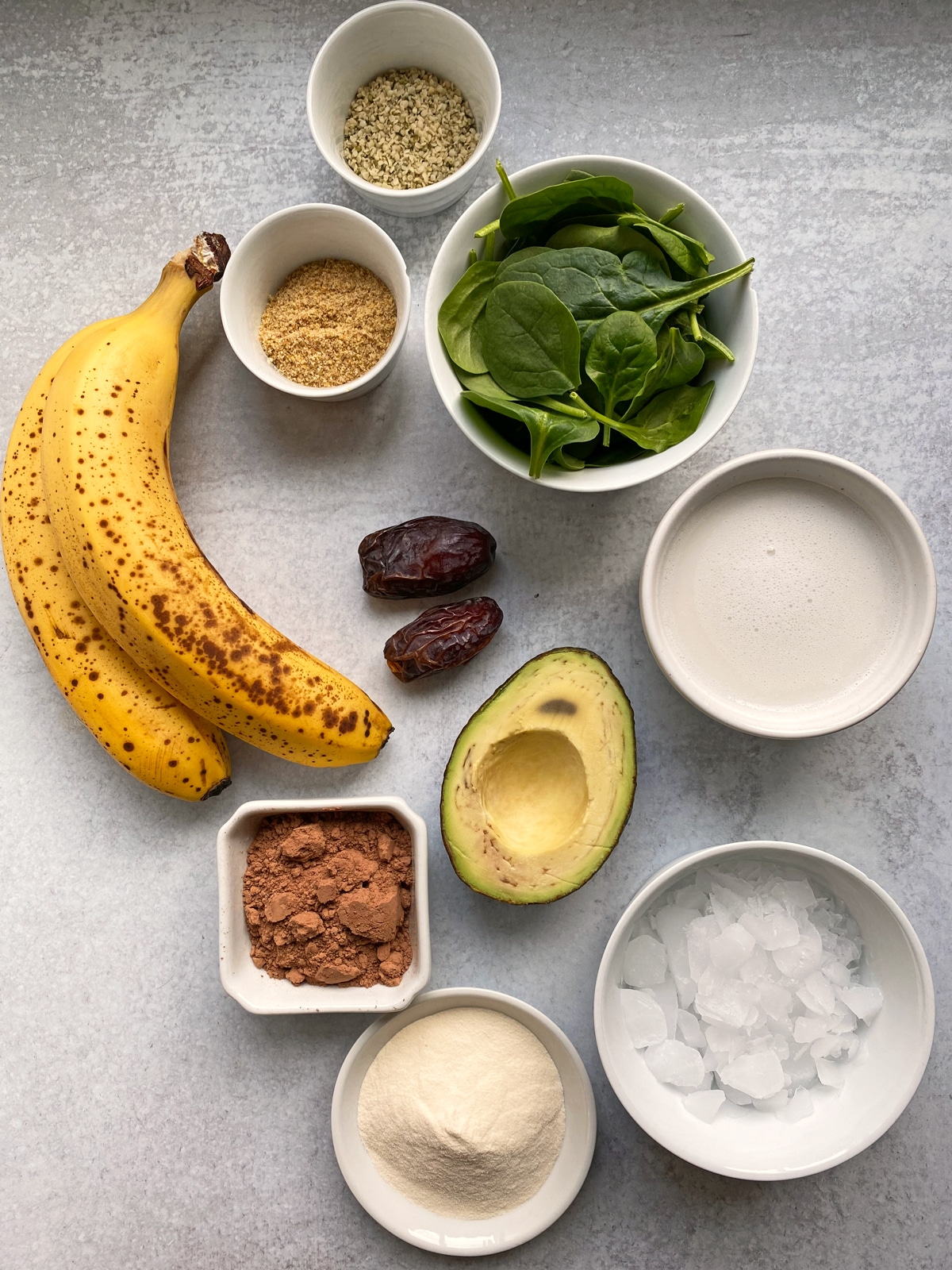 Ingredients needed to make an avocado chocolate smoothie.