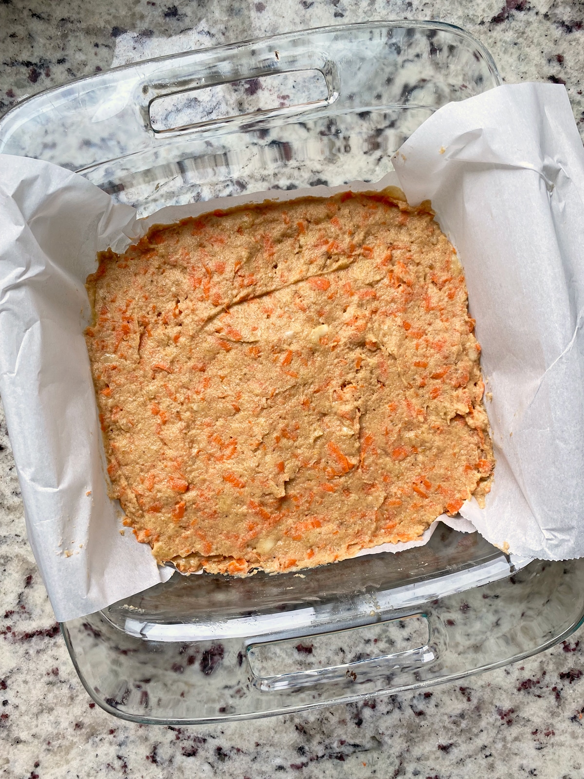 unbaked bars in glass pan