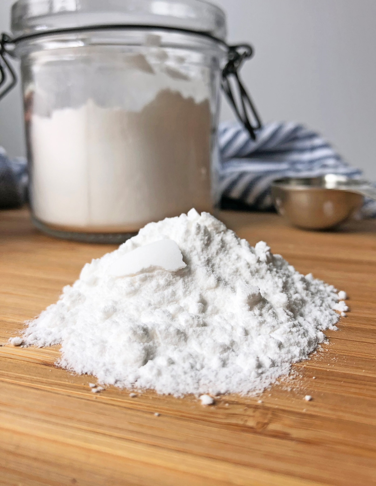 pile of baking powder sitting on wooden cutting board