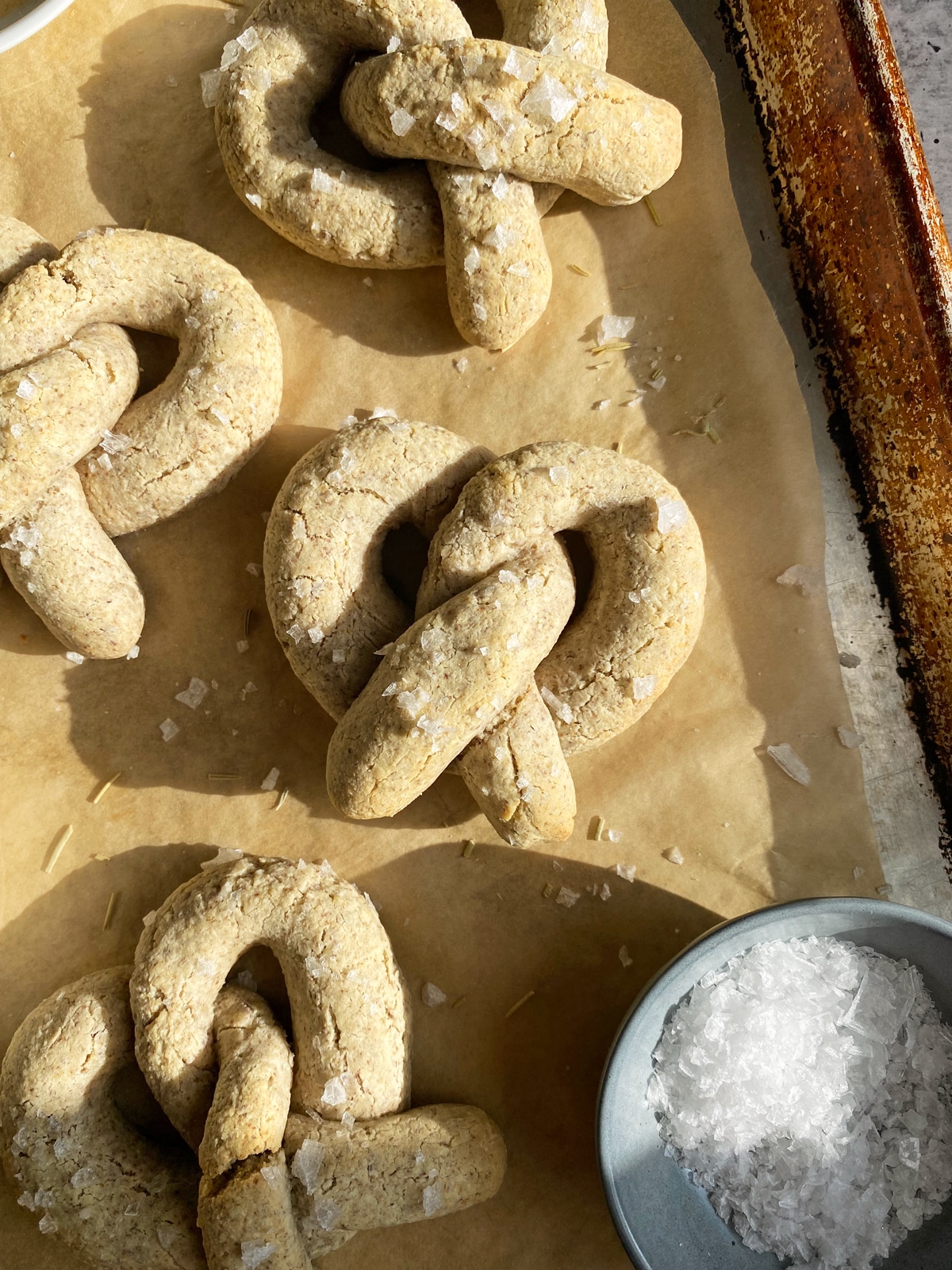 vegan soft baked pretzels on lined baking sheet