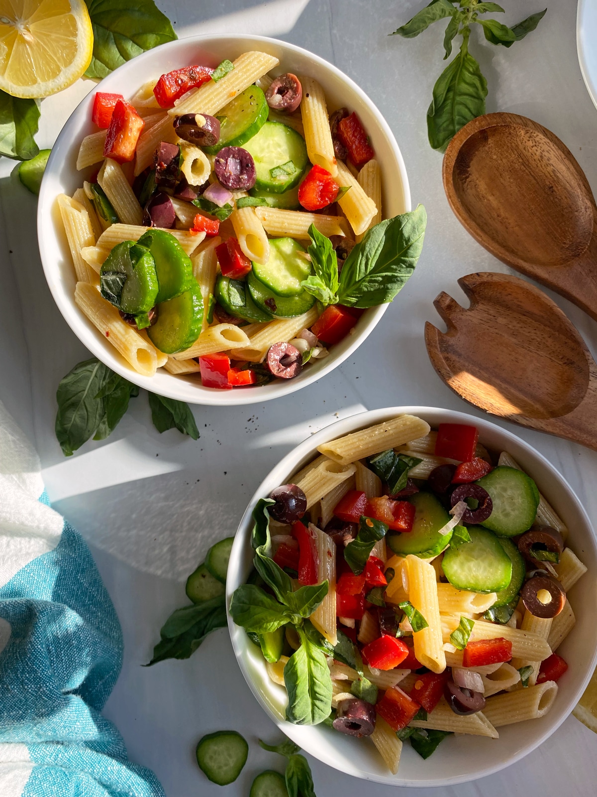 two bowls of pasta salad