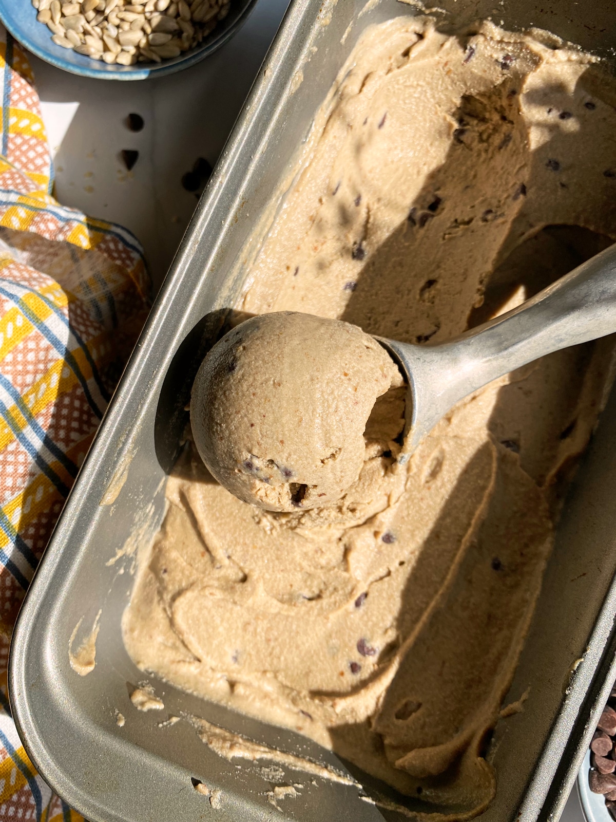 scooping the ice cream from the loaf pan