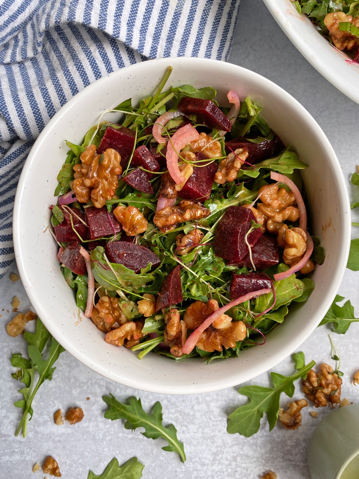 arugula and beet salad in serving bowl