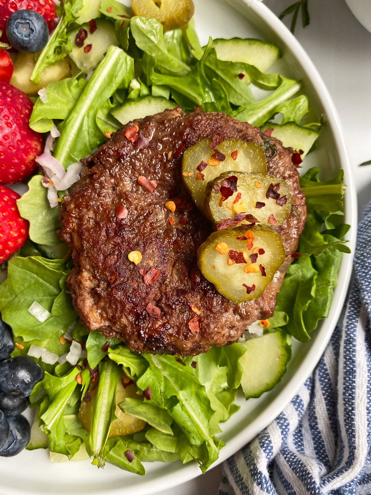 homemade lamb burger on arugula