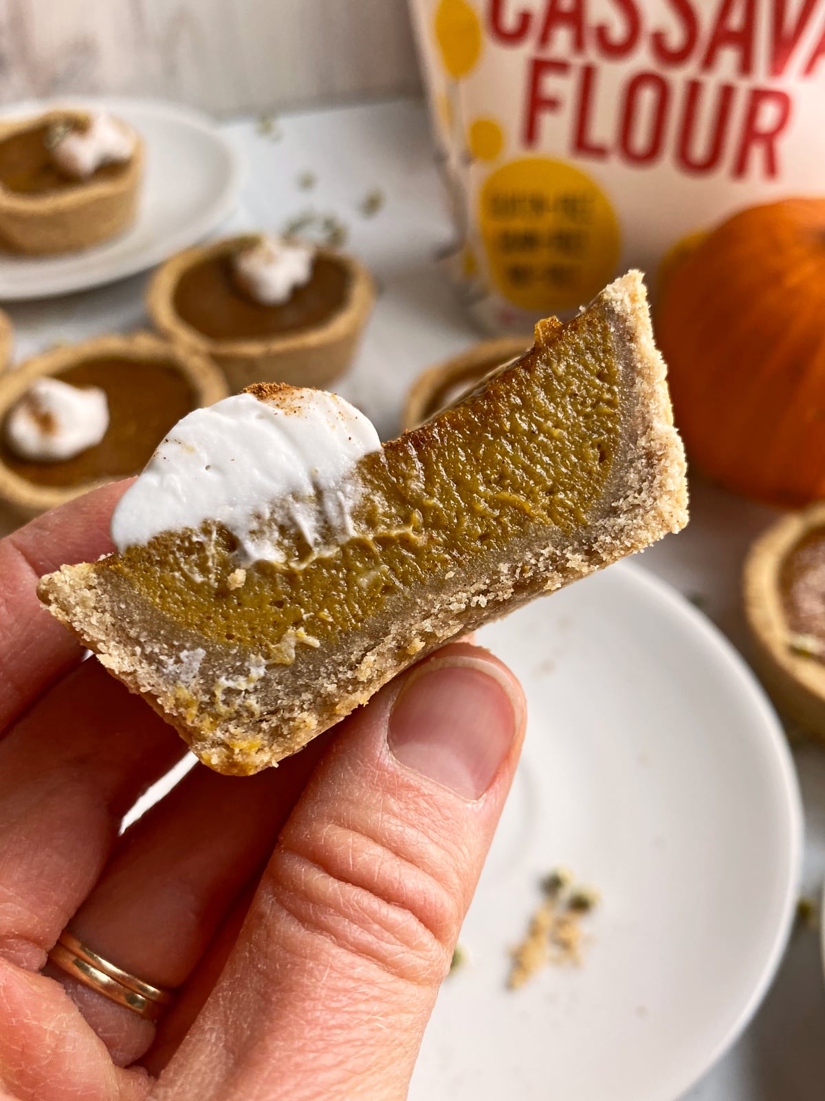 holding a pie that's been cut in half