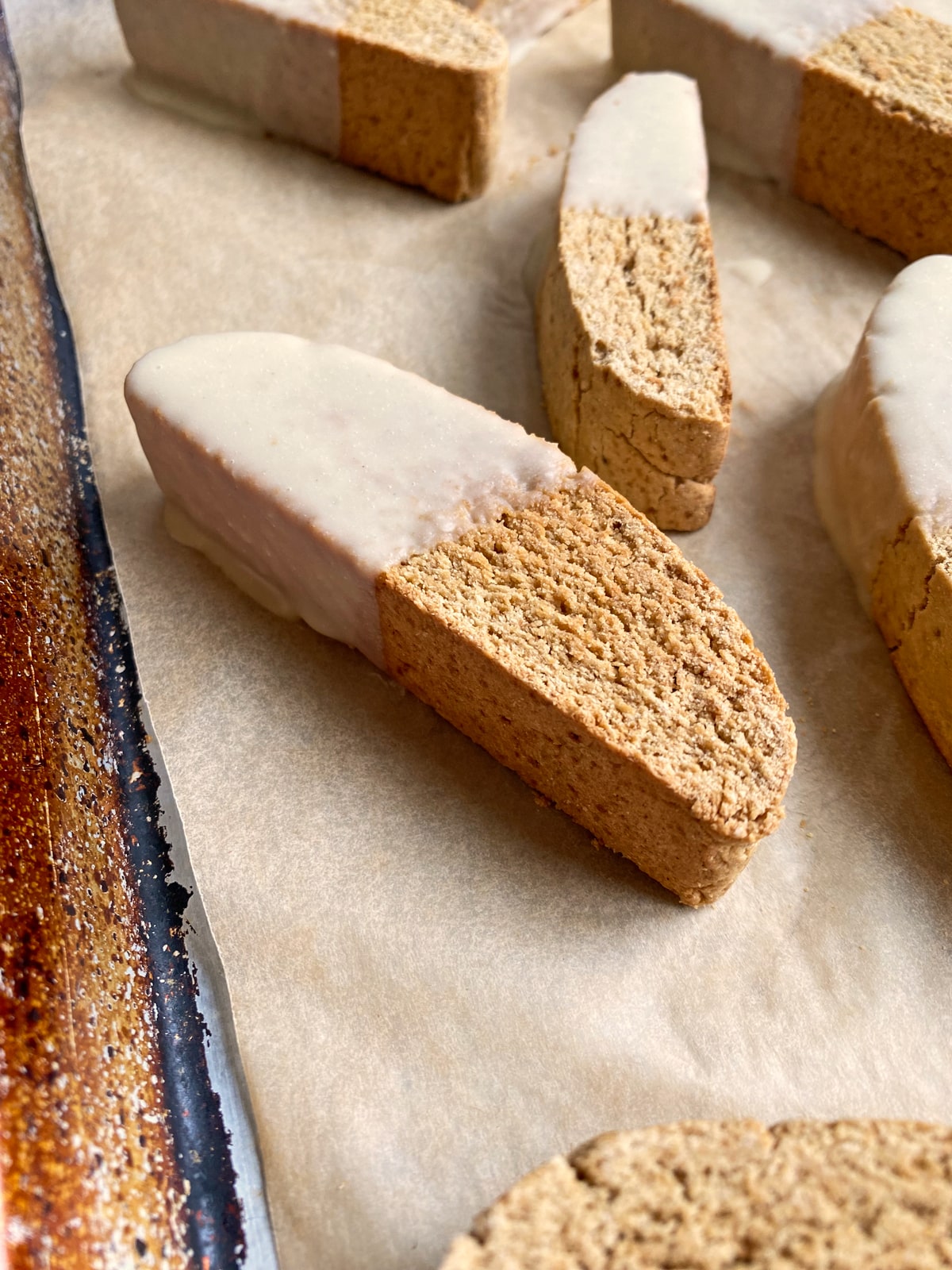 dipped biscotti on lined baking sheet