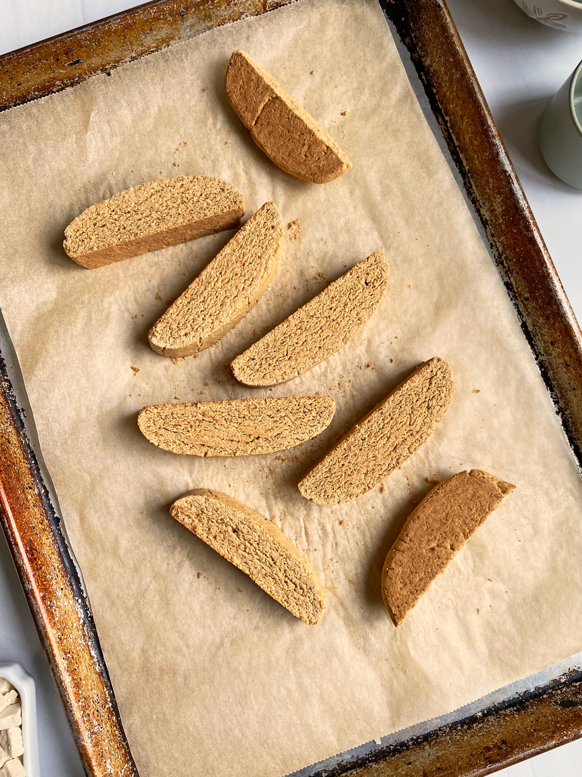 paleo biscotti on lined baking sheet