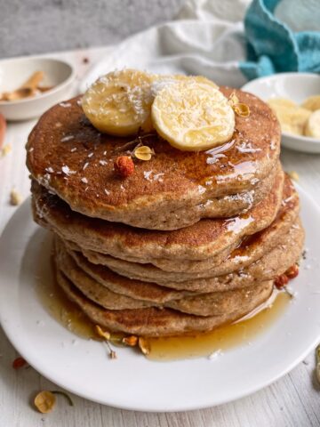 pancakes topped with maple syrup