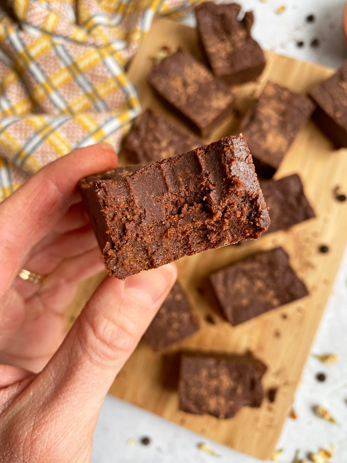 holding a bite of a brownie