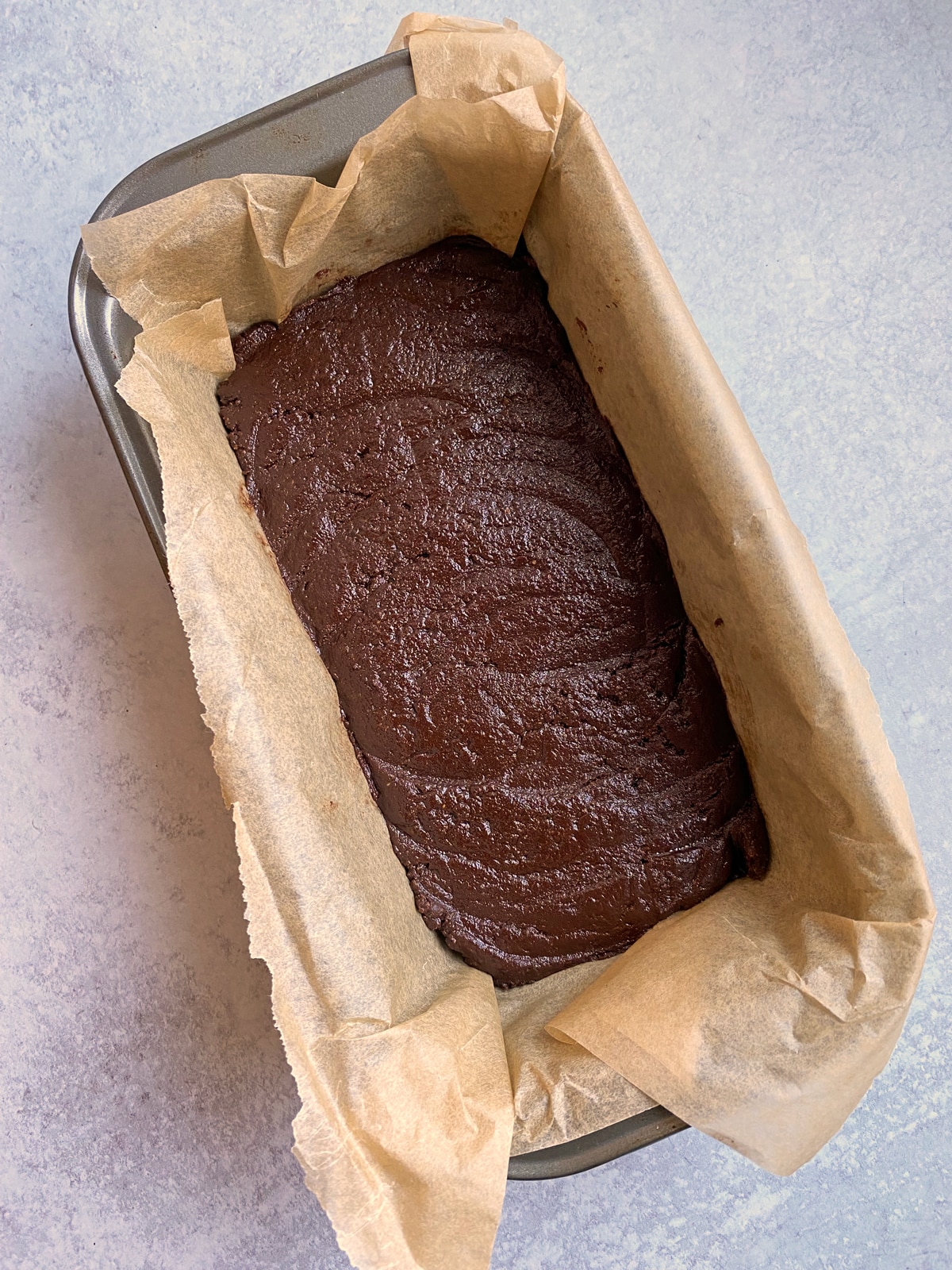 hemp protein brownie batter in lined loaf pan