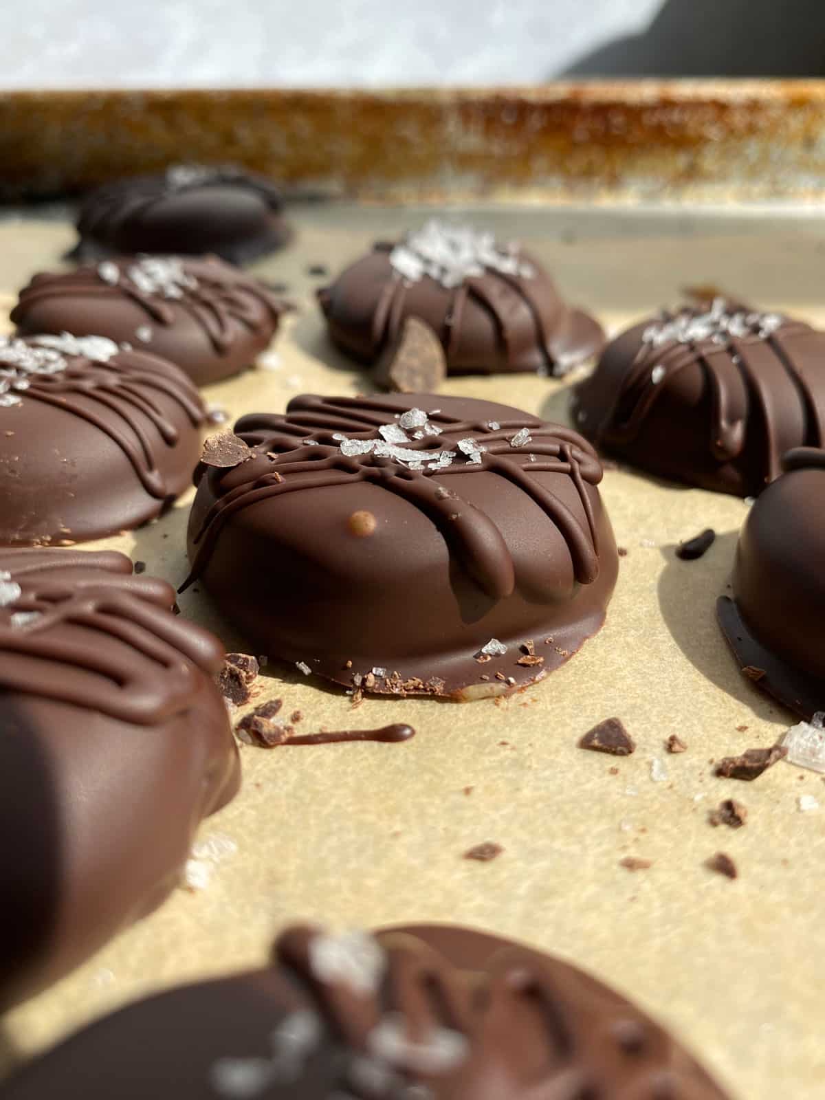 side view of caramels dipped in chocolate