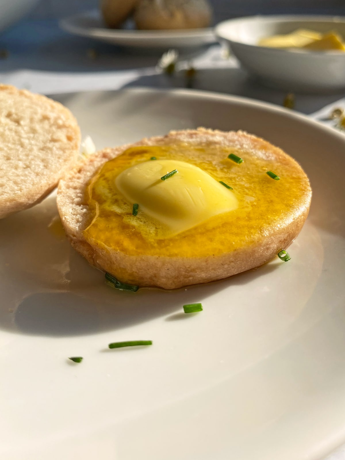 roll topped with butter and chives