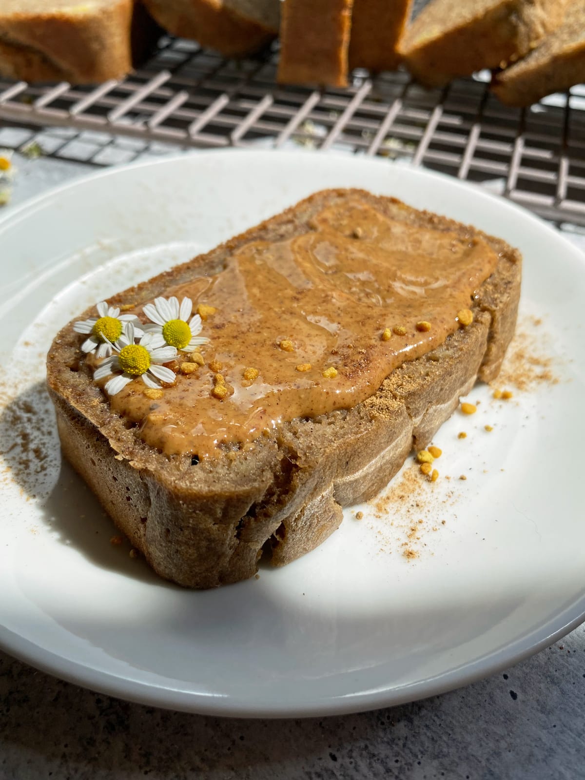 slice of paleo cassava banana bread topped with almond butter