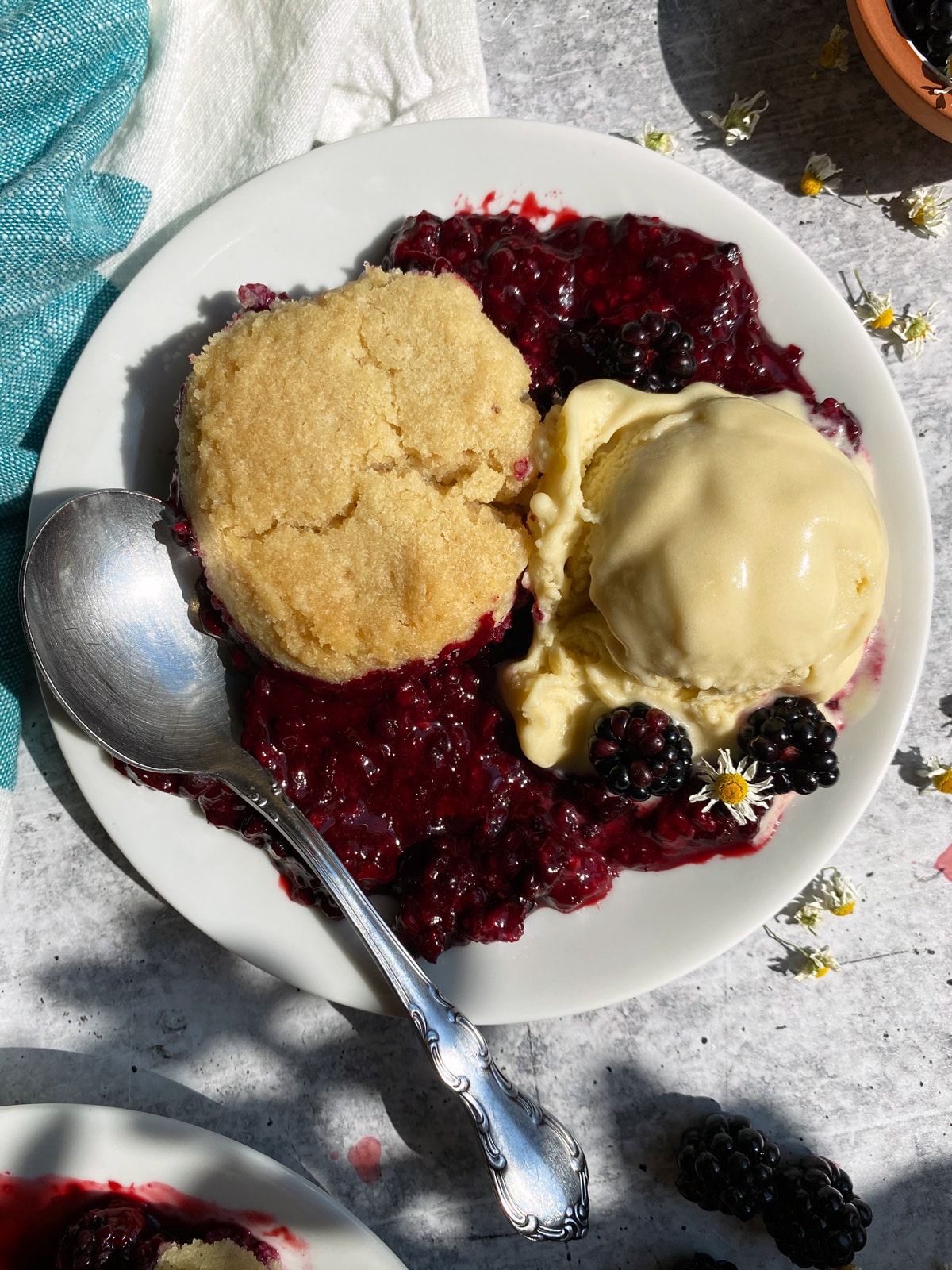 plated blackberry cobbler with vanilla ice cream