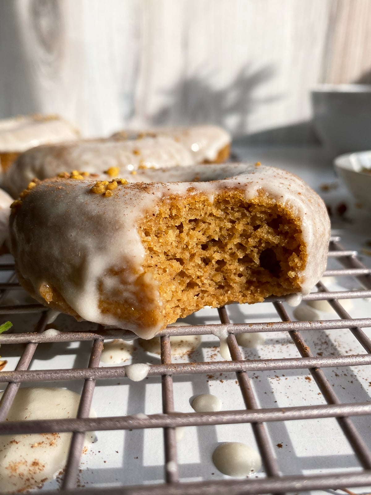 Bite shot to show the inside texture of the squash donuts.