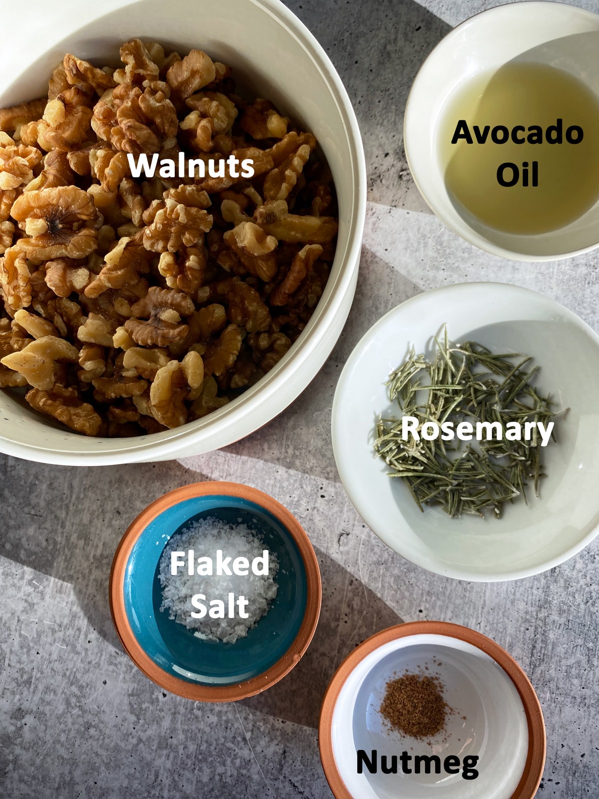 Ingredients in savory rosemary roasted walnuts.