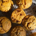 Pumpkin muffins on wire cooling rack.