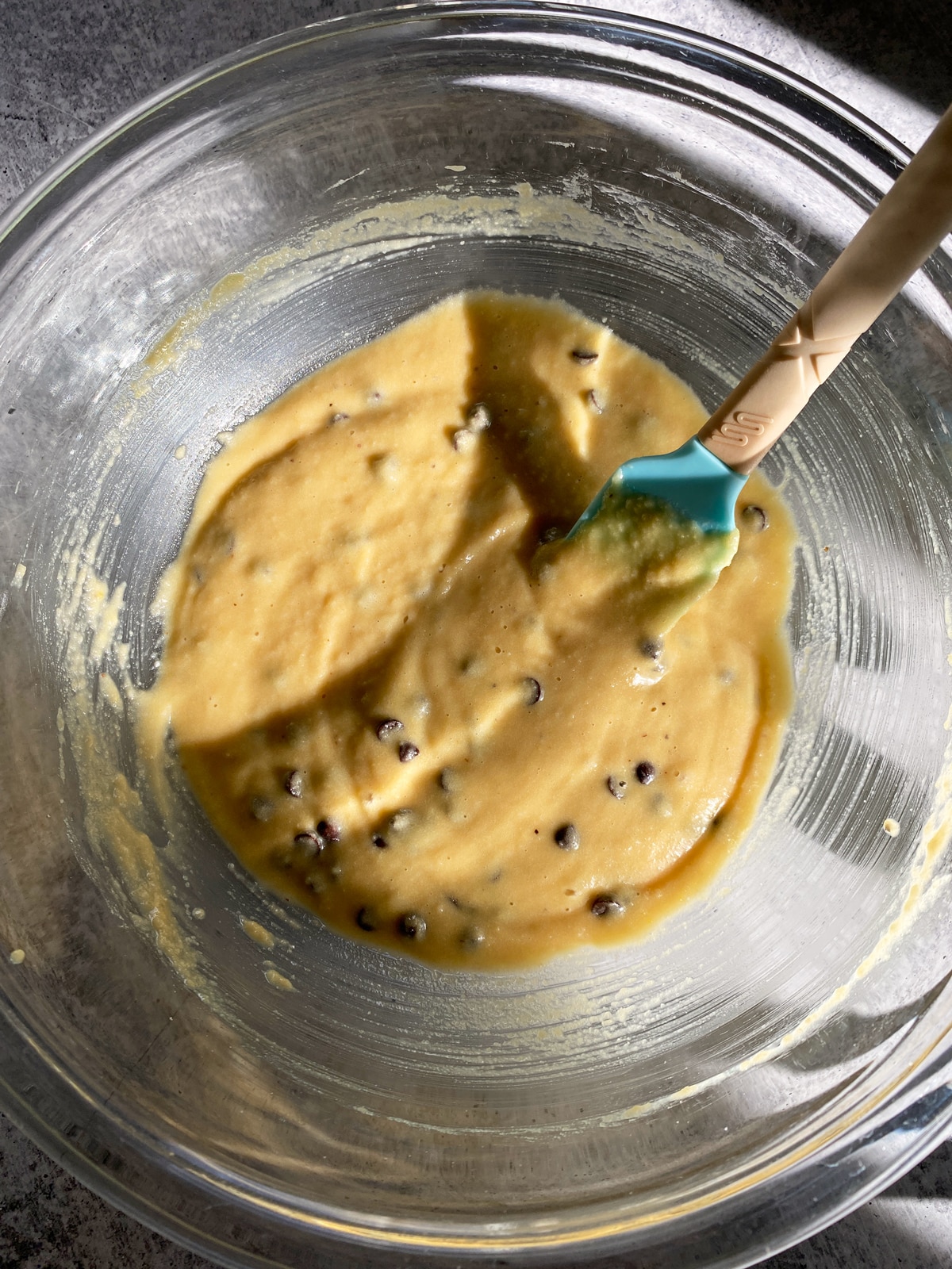 Chocolate chip donut batter in mixing bowl.