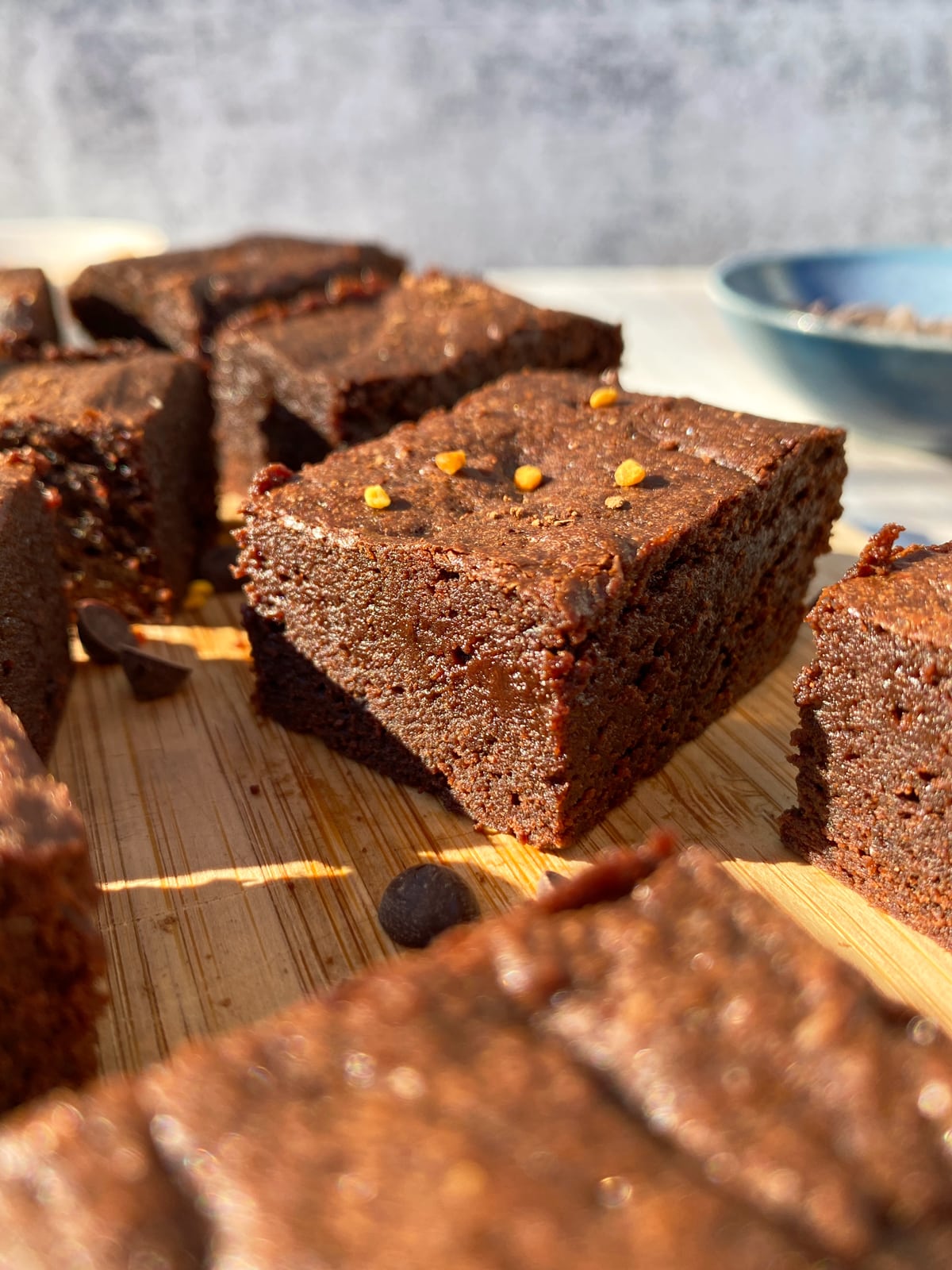 Side view of buckwheat brownie topped with bee pollen.