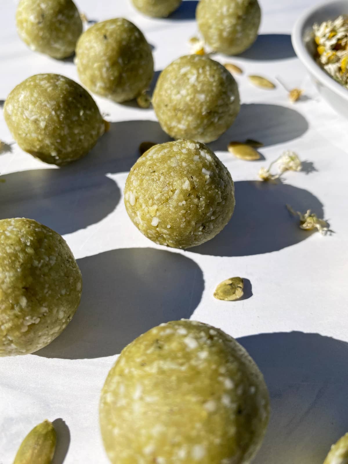 Side view of green protein ball.
