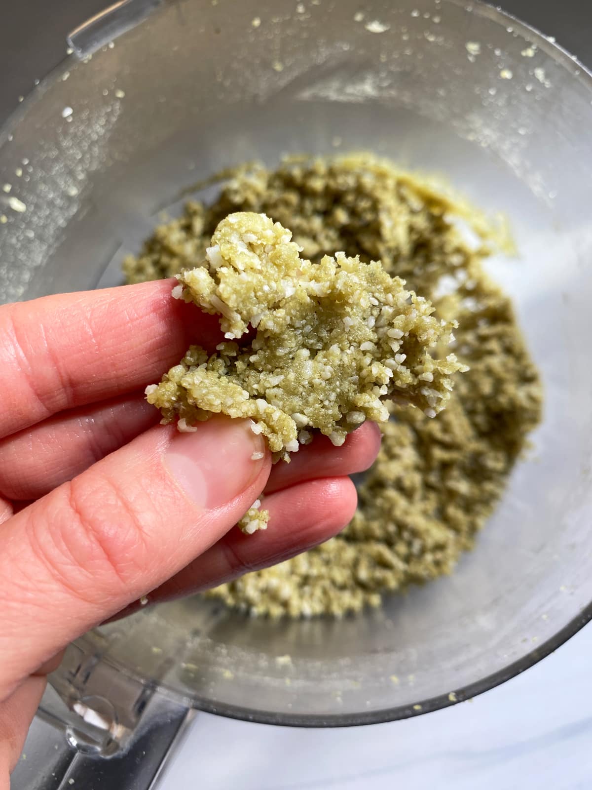 Showing the texture of the dough for the protein balls.