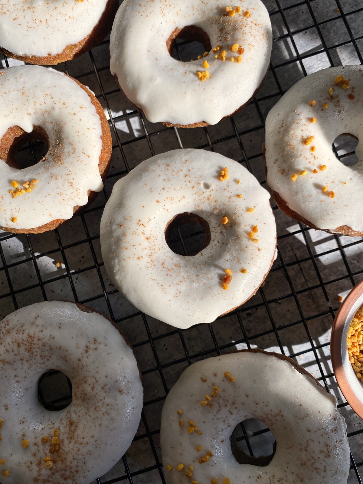 Paleo vegan donuts on wire cooling rack.