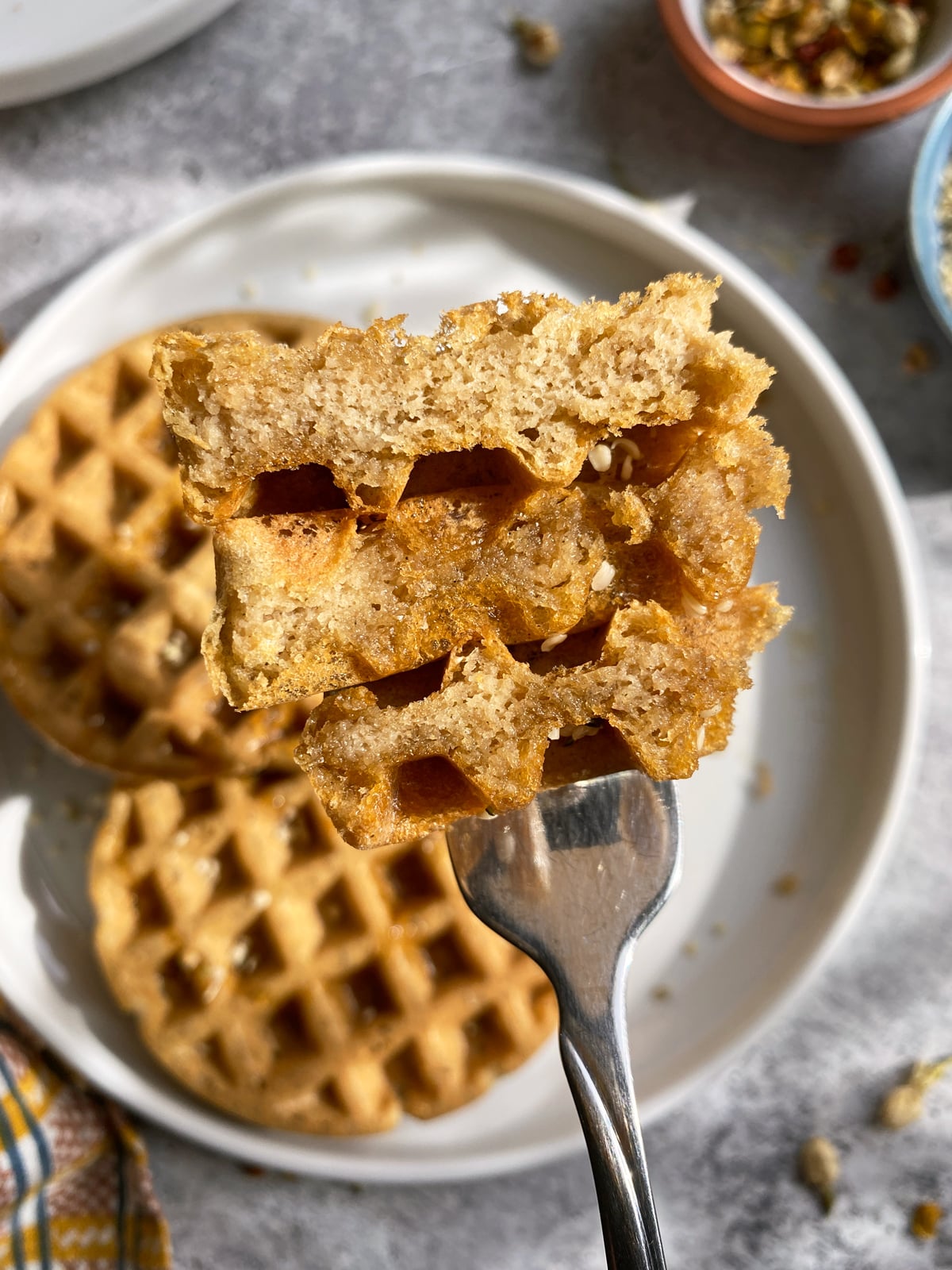 Fork full of waffle to show the inside texture.