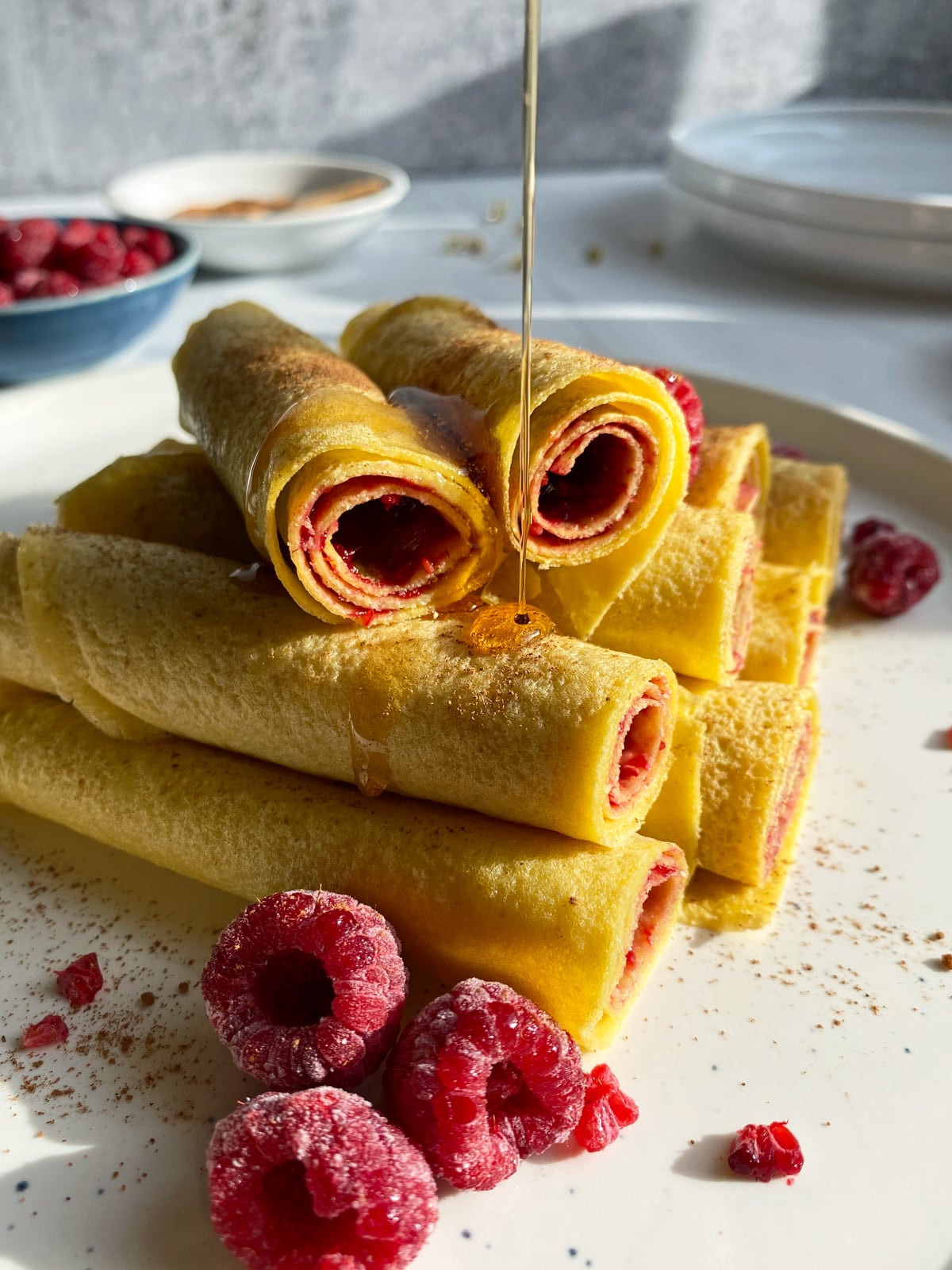 Coconut flour crepes topped with maple syrup.