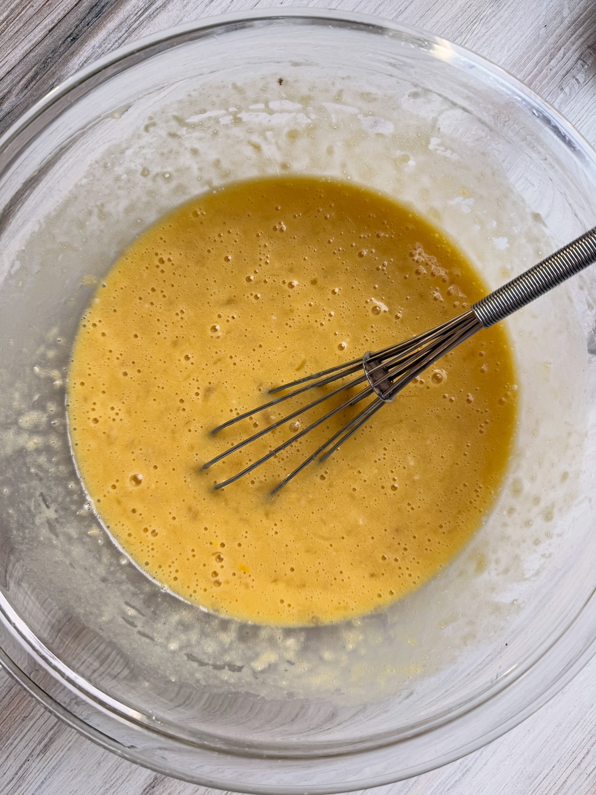 Whisked wet bread ingredients.