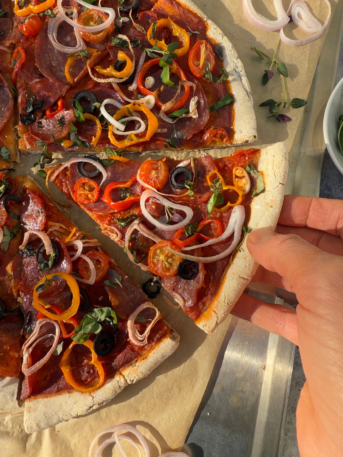 Grabbing a slice of pizza.