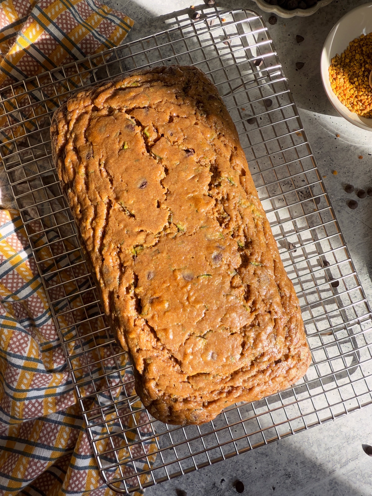 Baked loaf cooling on a wire cooling rack.