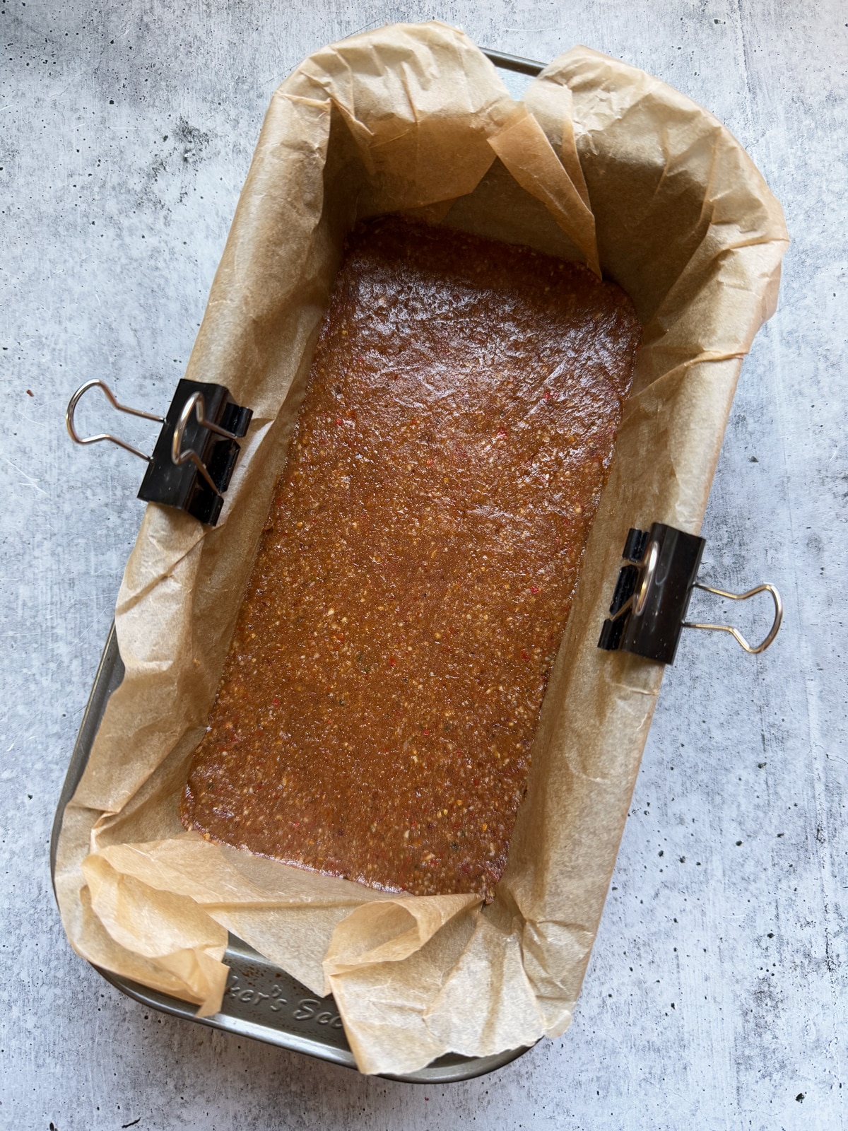 Base for protein bars in a lined loaf pan.