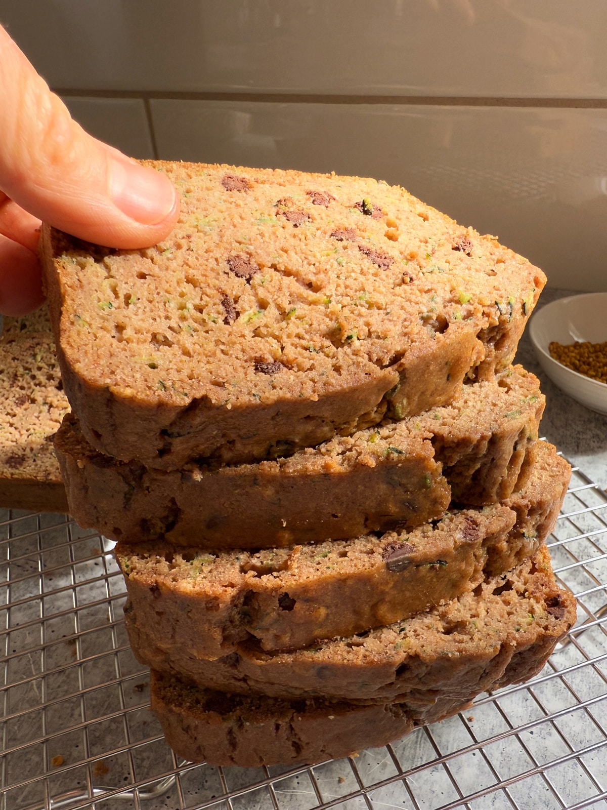 Stack of sliced buckwheat zucchini bread.