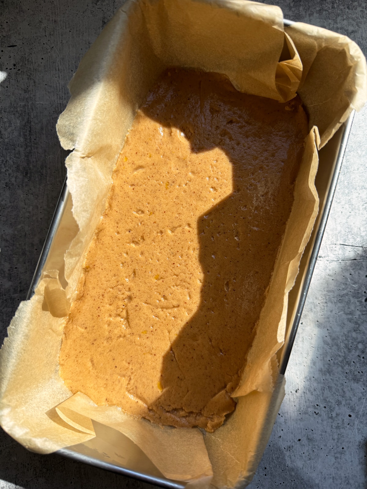 Base pressed into a lined loaf pan.