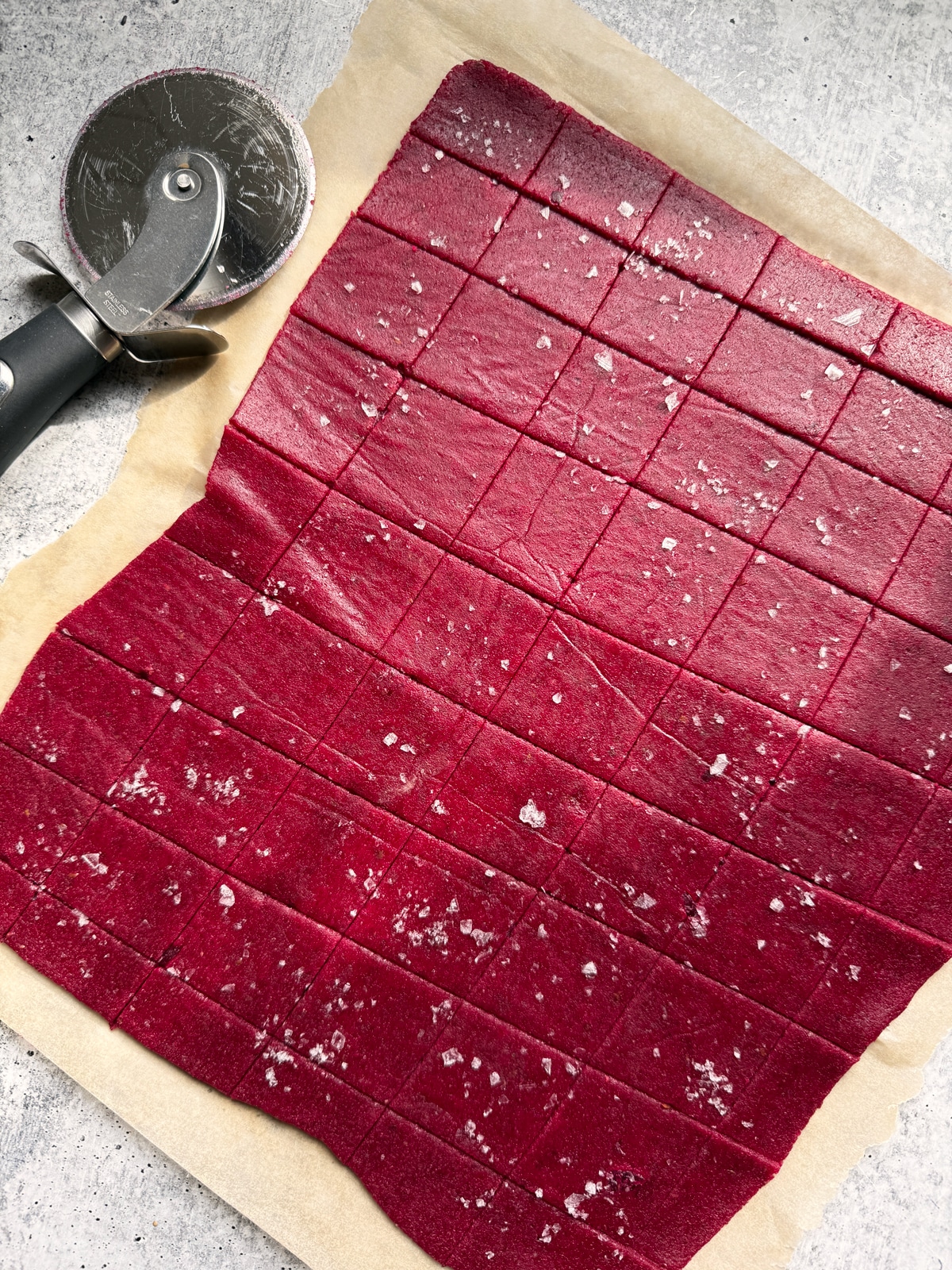 Cut crackers topped with salt and ready to bake.