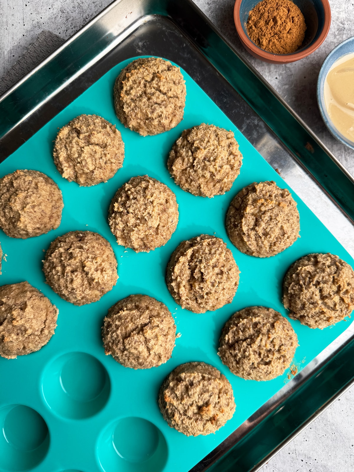 Freshly baked muffins in muffin tin.