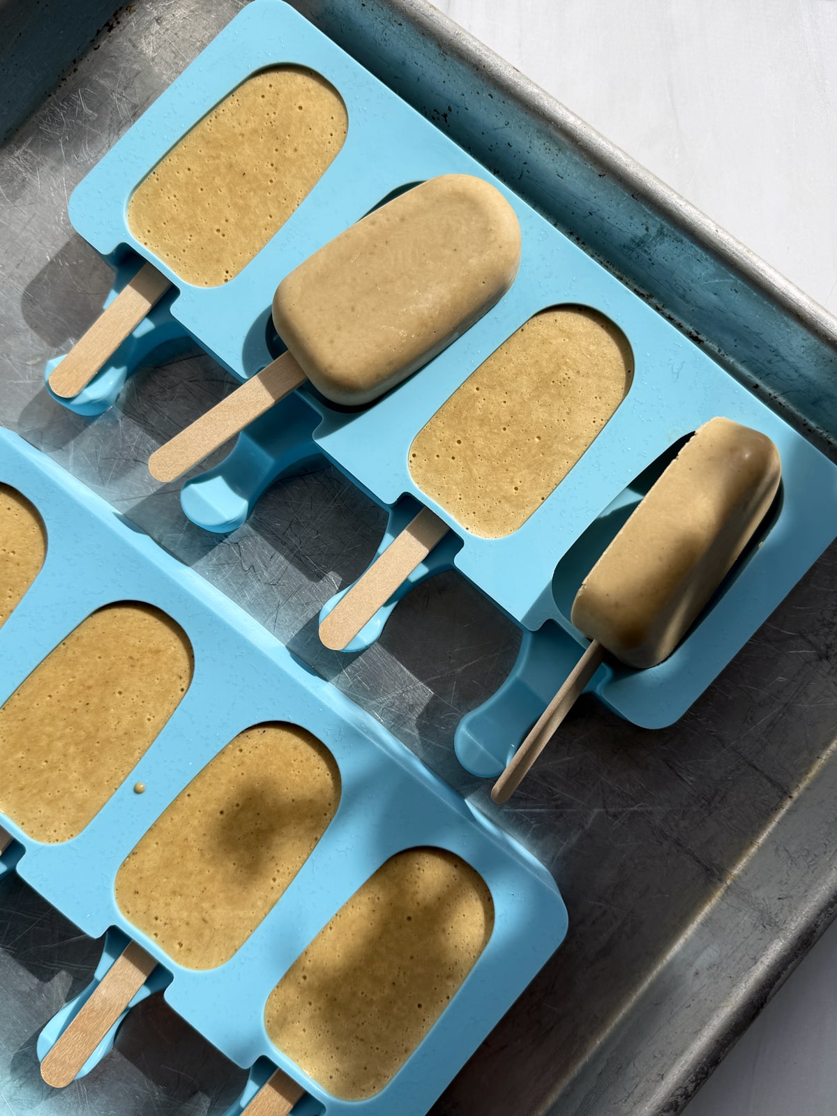 Frozen fillings in popsicle molds.