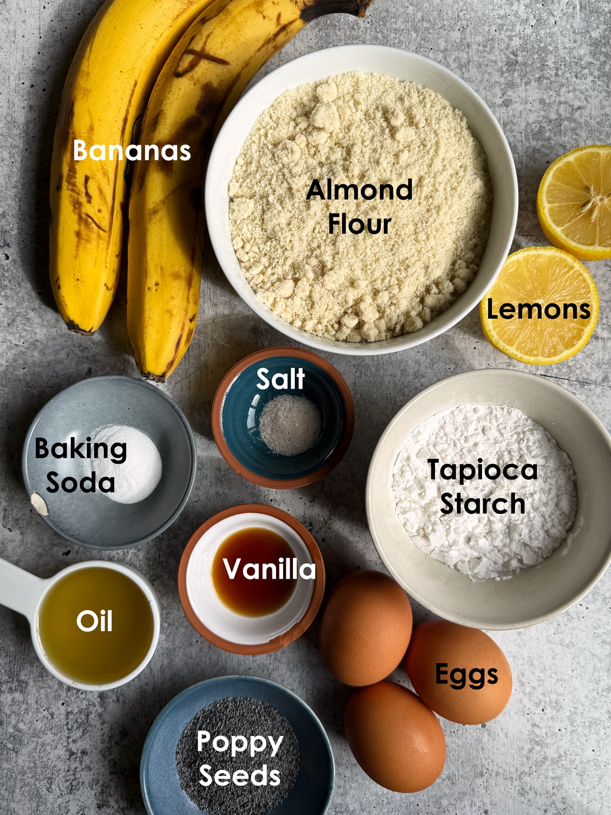 Ingredients needed to make healthy lemon poppy seed banana bread.