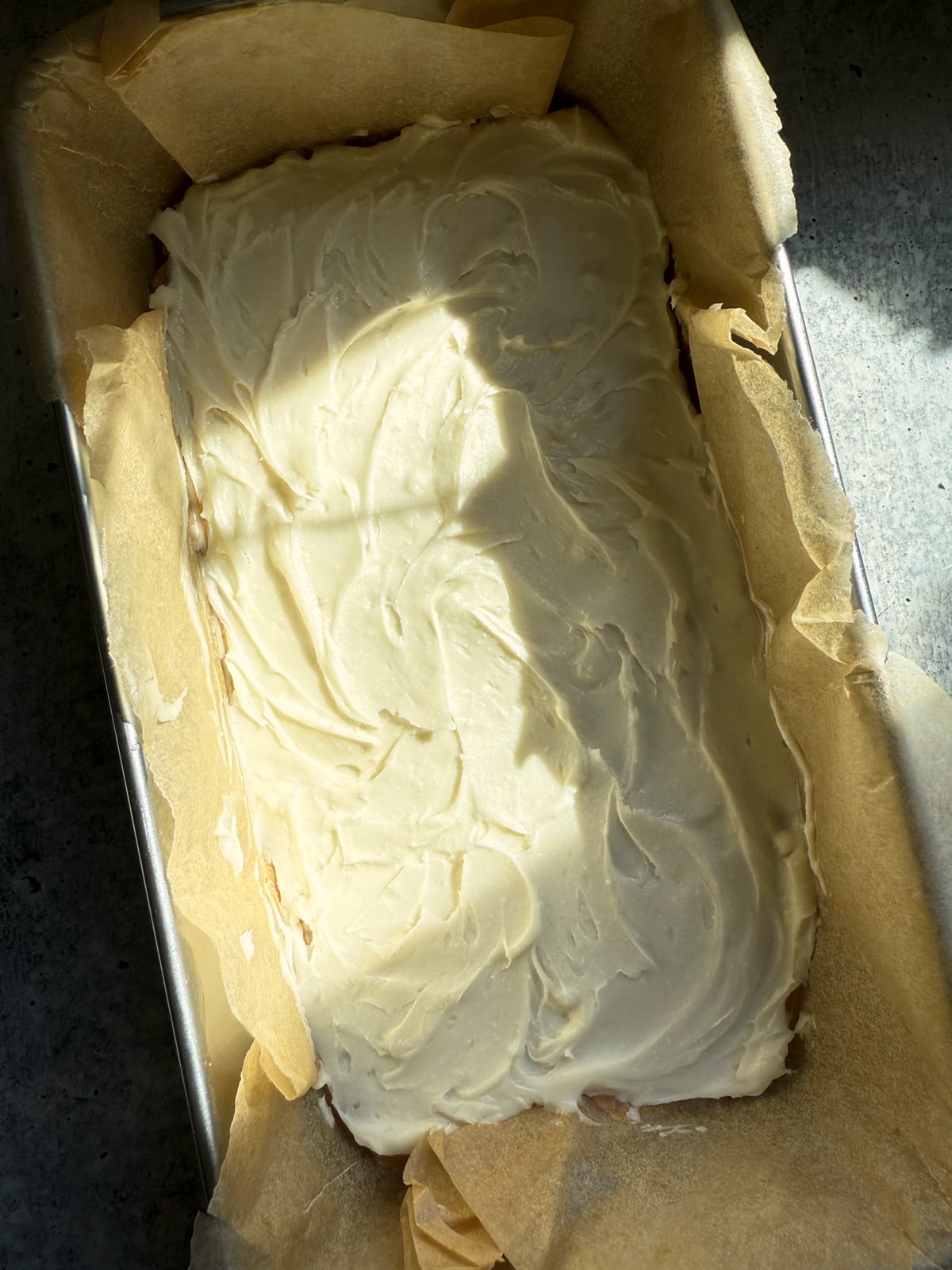 Frosted lemon bars ready to chill.