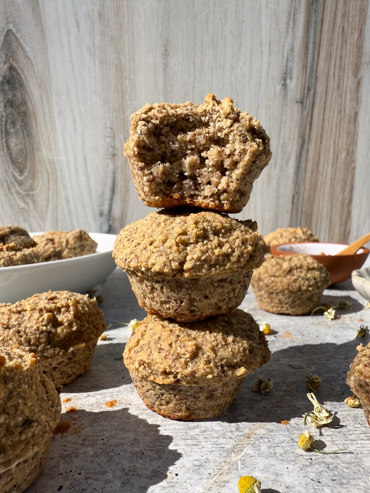 Stack of three tahini banana muffins.