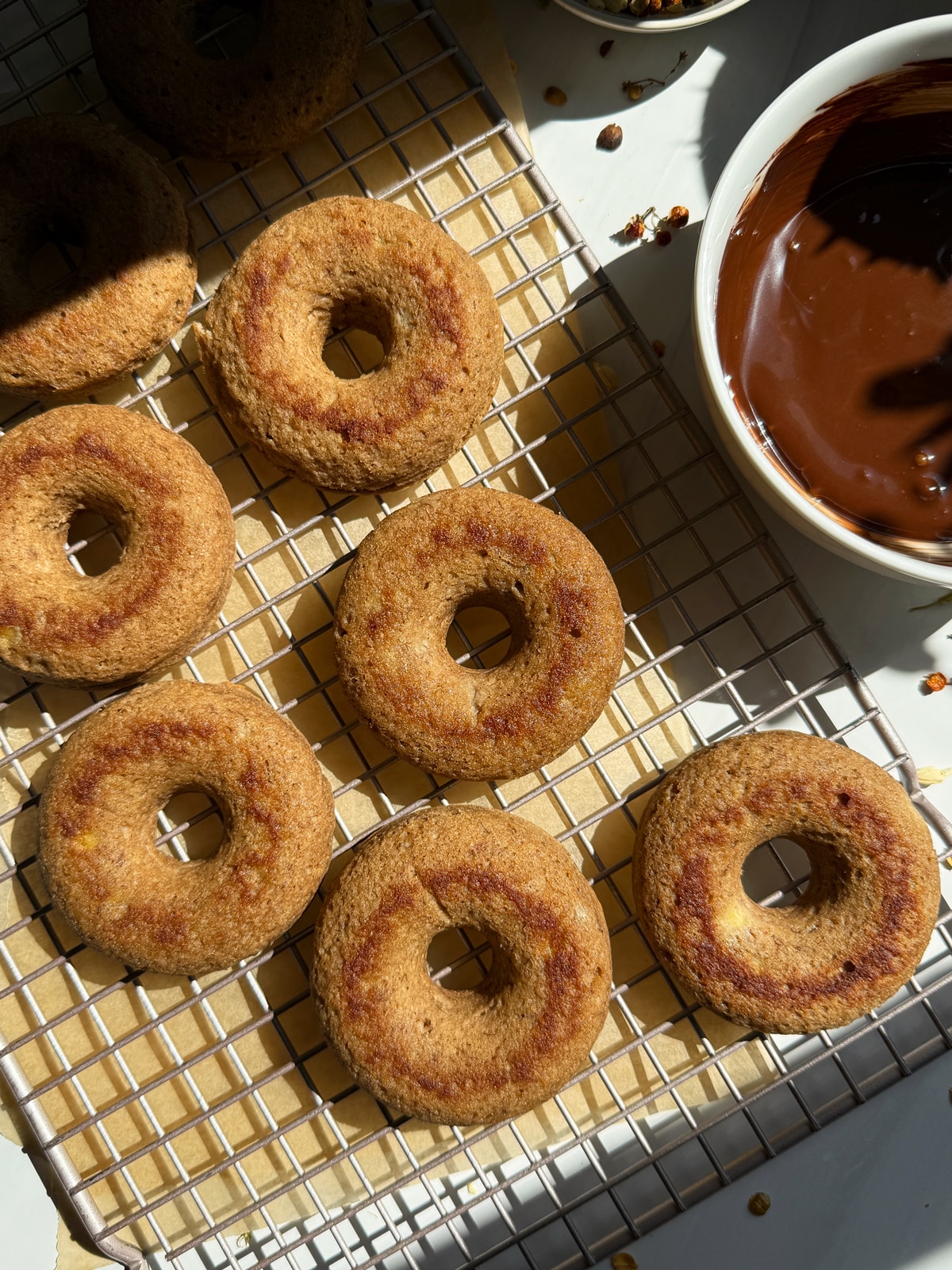 Baked donuts ready to dip in the chocolate glaze.