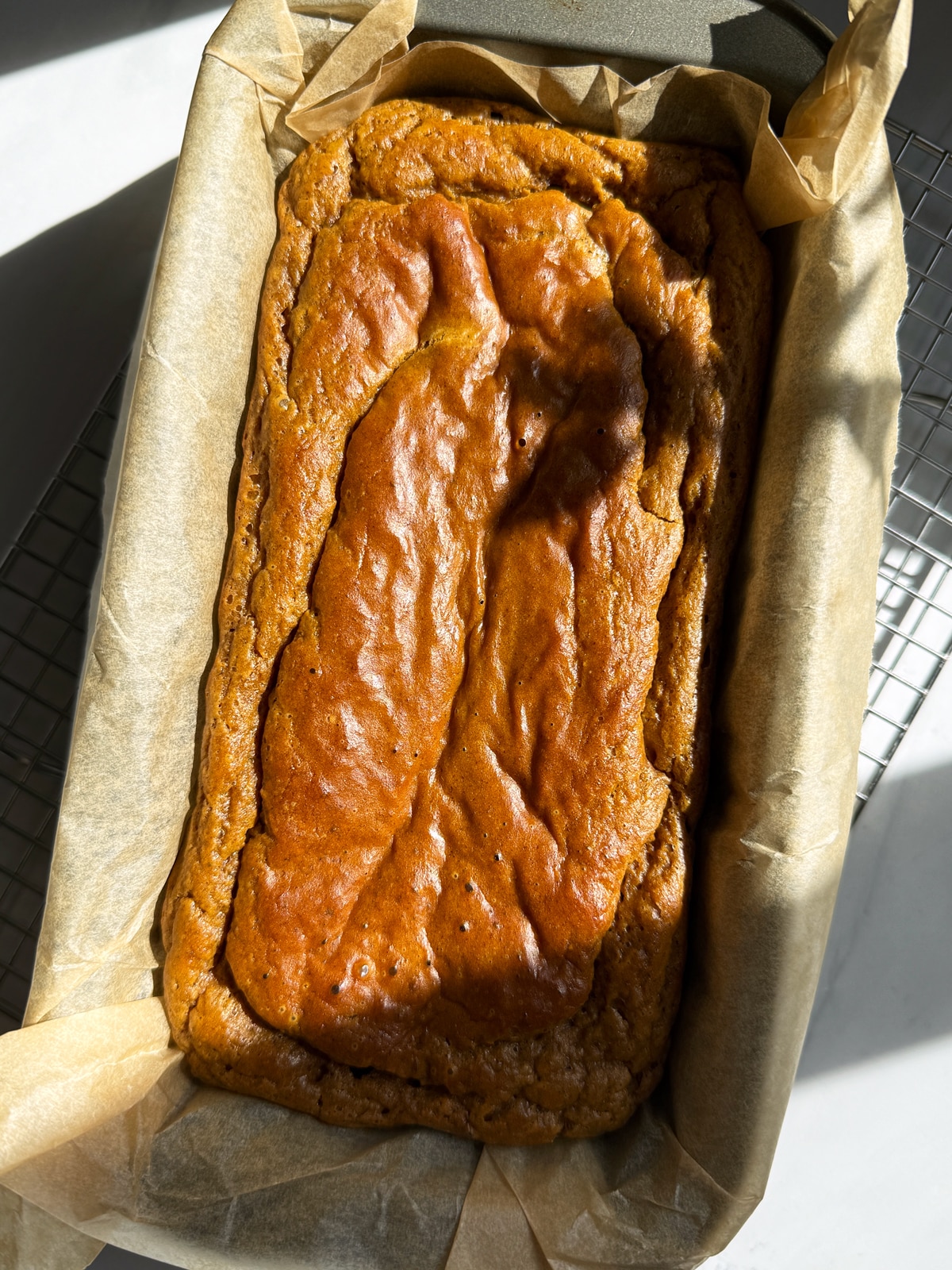 Freshly baked bread in loaf pan.