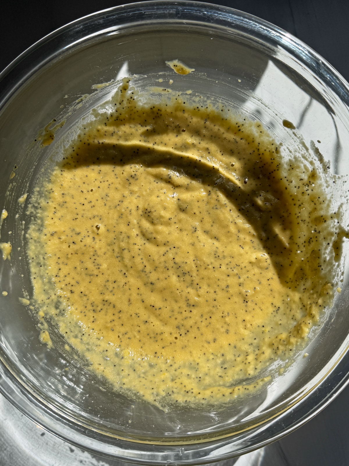 Batter for lemon poppy seed donuts.