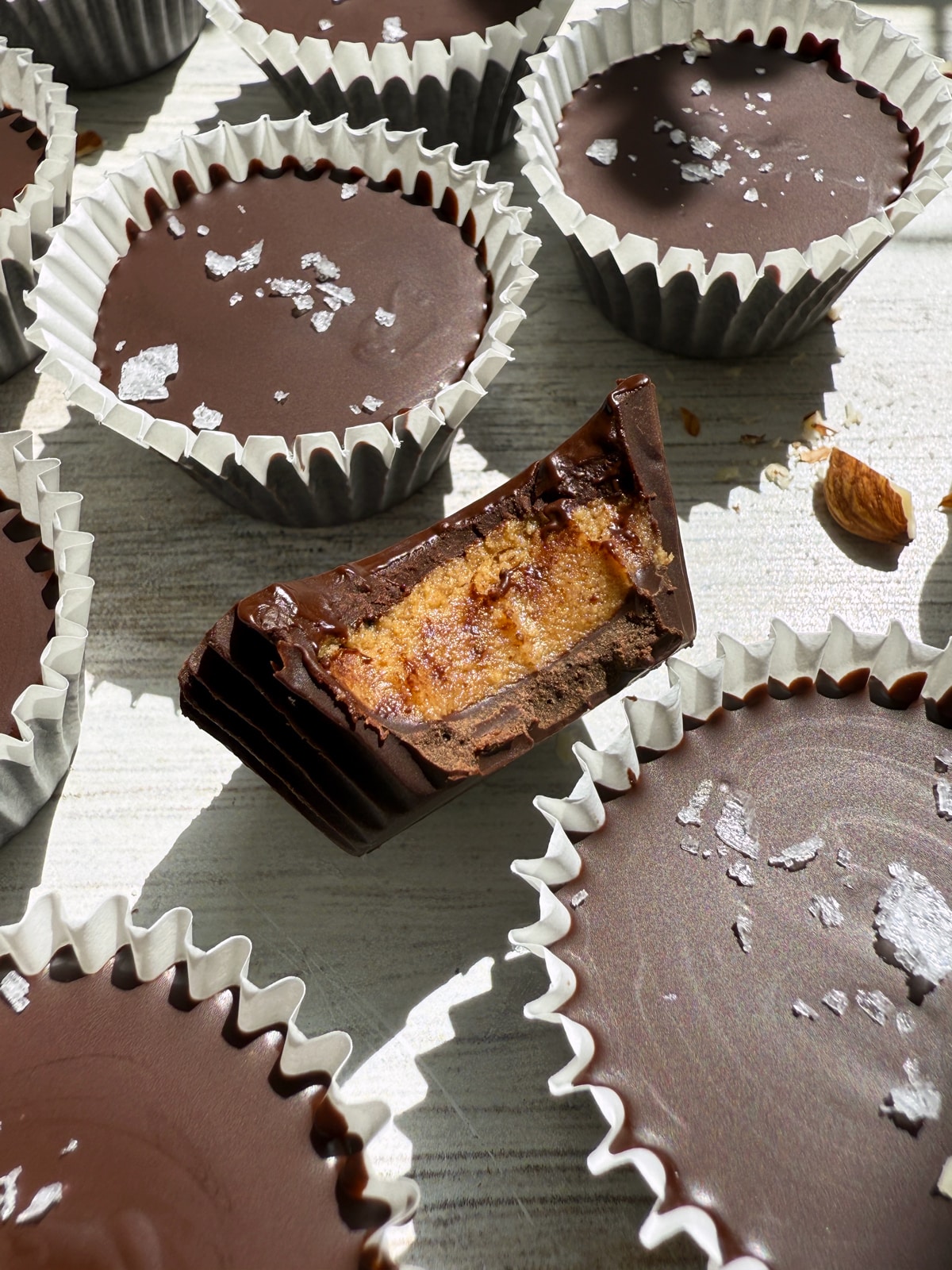 Bite of an almond butter cup to show the inside.